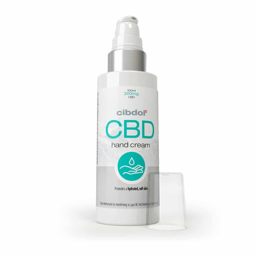 a bottle of cbd hand cream next to a container.