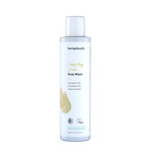 A bottle of Hemptouch - Comforting Cream Body Wash (250ml) with hempseed oil, grapeseed oil, and litsea cubeba. The bottle is white with a green droplet design and a capacity of 250 ml.
